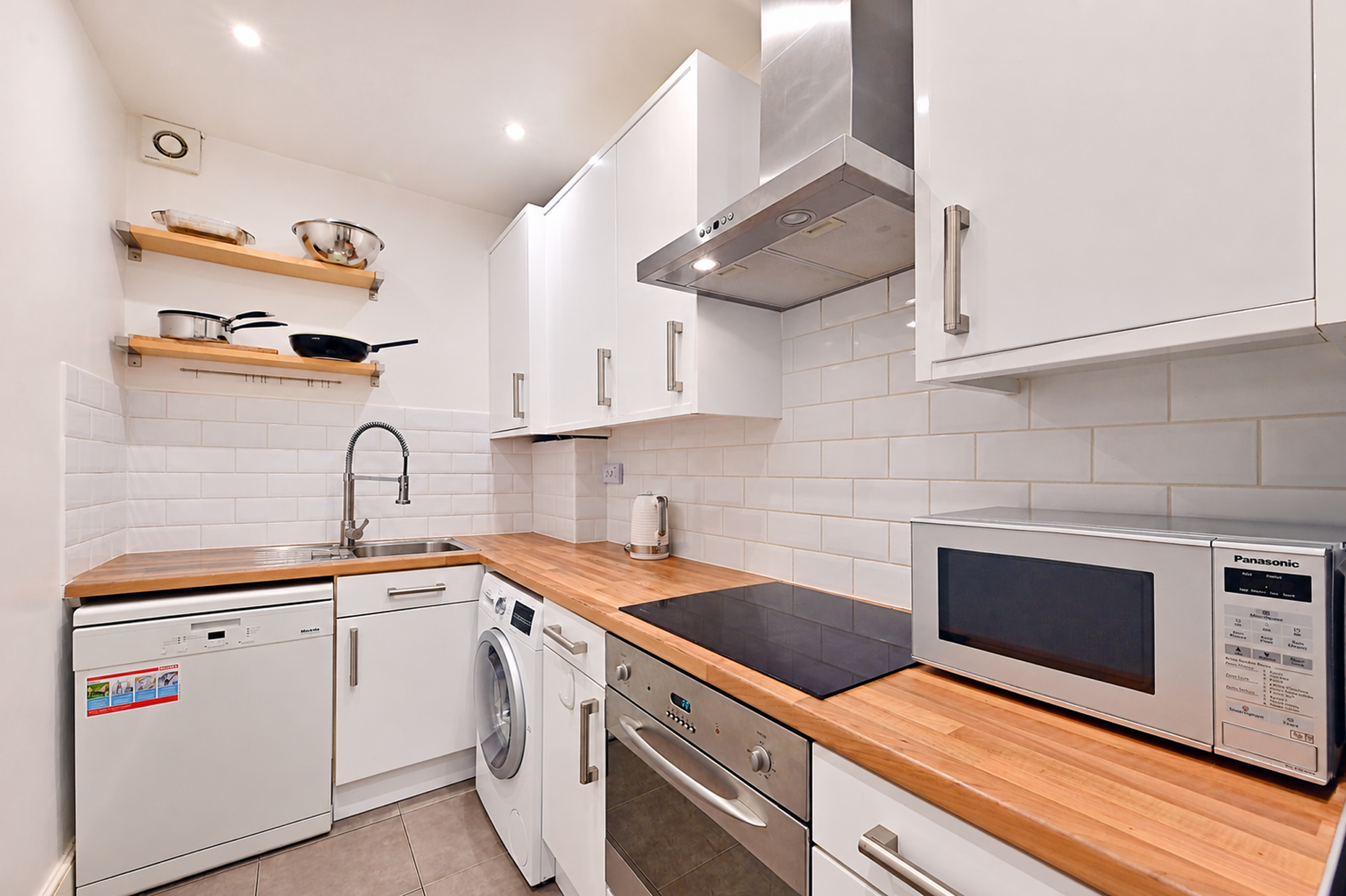 2687080__1791019038-177698-ModernGalleyKitchenwithWarmWoodAccents-2x-scaled.png